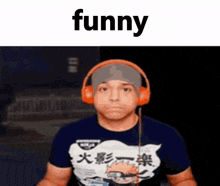 a man wearing headphones and a shirt that says `` funny '' is making a face .