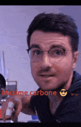 a man wearing glasses and a smiley face has the word maxime carbone above him