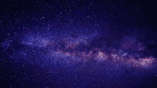 a purple and pink galaxy with many stars in the night sky