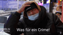 a man wearing a mask and a spiegel tv reportage advertisement