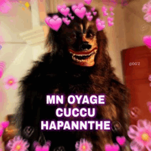 a picture of a werewolf with pink hearts on his head and the words `` mn oyage cuccu hapannthe '' .