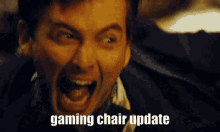 a man is screaming with his mouth open and the words gaming chair update written on his face .