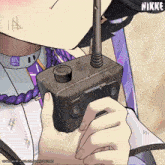 a close up of a person holding a walkie talkie with the word nikke on the bottom