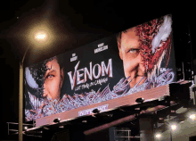 a movie billboard for venom let there be carnage