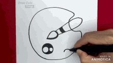 a person is drawing a palette with a brush on a piece of paper that is made in animatica