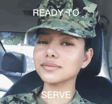 a woman in a military uniform is sitting in a car with the words " ready to serve " written above her