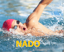 a man is swimming in a pool with the word nad on the bottom right