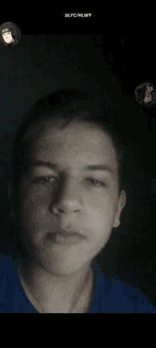 a young man 's face is shown in a dark room with the temperature reading 38 degrees