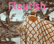 a man in a cape is standing in front of trees and the word flourish is on the bottom