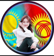 a woman sits in front of a circle with a flag on it