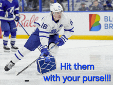 a hockey player with the number 16 on his jersey is skating on the ice