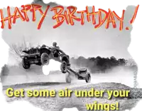 a black and white photo of a jeep being pulled by another jeep with the words happy birthday get some air under your wings