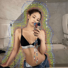 a woman in a calvin klein bra takes a picture of herself in a mirror