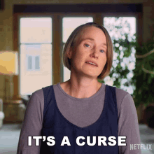 a woman says " it 's a curse " in front of a netflix logo