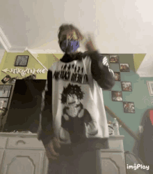 a person wearing a mask and a shirt that says my hero academia is standing in a living room