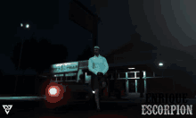 enrique escorpion is standing in front of a store at night