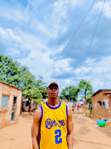 a man wearing a yellow jersey with the number 2