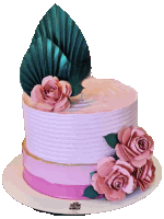 a pink and white cake with pink flowers and green leaves on top