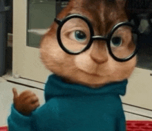 a close up of a chipmunk wearing glasses and a blue sweater giving a thumbs up .