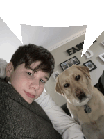 a boy and a dog are posing for a picture in front of a family wall