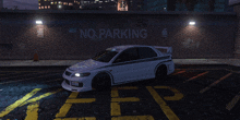 a white car is parked in front of a wall that says no parking