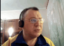 a man wearing glasses and headphones is talking