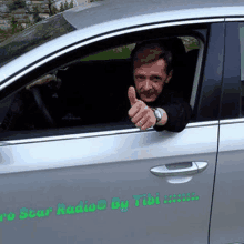 a man giving a thumbs up in a car with the words pro star radio by tibi on the side