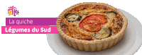 a quiche on a white plate with the words la quiche legumes du sud