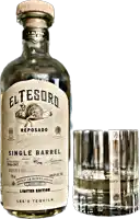 a bottle of el tesoro reposado single barrel tequila next to a glass