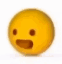 a blurred image of a yellow smiley face with a surprised look on its face .