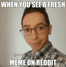 a man wearing glasses and a plaid shirt has a meme on reddit