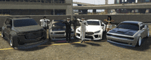 a group of people are posing for a picture in front of a row of cars