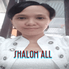 a woman wearing a white jacket with the word shalom all written on it