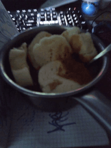 a bowl of food sits on top of a piece of paper that says ' x ' on it