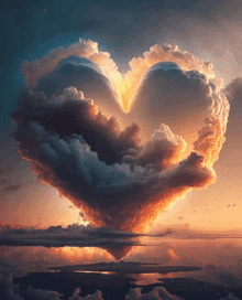 a cloud in the shape of a heart rises over a body of water