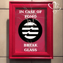 in case of fomo break glass is written on a red framed picture