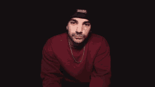 a man wearing a black thinsulate beanie