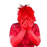 a person with red hair and red gloves covering their face with their hands