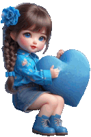 a little girl in a blue shirt is holding a blue heart pillow