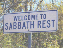 a sign that says welcome to sabbath rest in front of trees