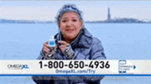 a woman is sitting on a bench holding a bottle of water and a phone number .