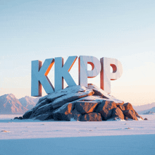 the word kkpp is displayed on a rock in the snow