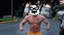 a shirtless man with a pixelated mask on his face