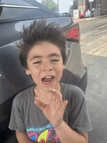 a boy wearing a shirt that says camaro elementary on it