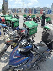 a group of motorcycles with grab boxes on top of them