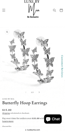 a pair of butterfly hoop earrings on luxe by mia website