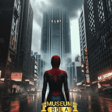 a poster for museum bola shows a man in a spiderman costume standing in front of a tall building