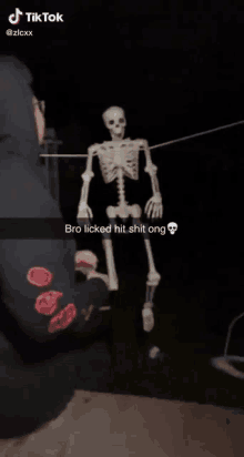 a skeleton is hanging on a clothes line with a tiktok caption