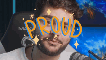 a man with a beard is sitting in front of a microphone with the word proud on his face