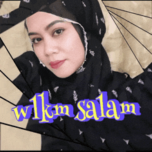 a woman wearing a black hijab is surrounded by the words wilkm salam